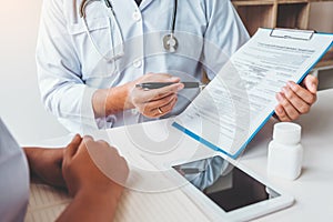 Doctors and patients Consulting about Treatment guidelines at office photo