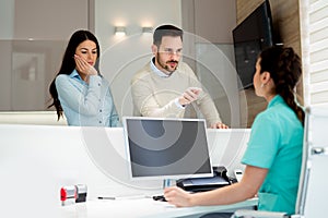 Doctors and patients speaking in the hospital waiting room