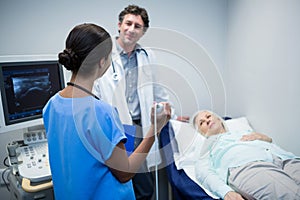 Doctors performing a doppler sonography