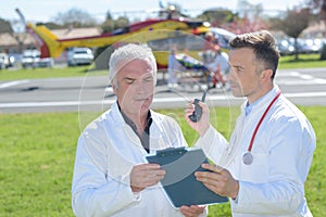 Doctors preparing in helicopter emergency medical service