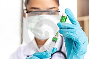 Doctors or scientists prepare a vaccine to prevent a new strain of influenza to inject the patient to create immunity in the body