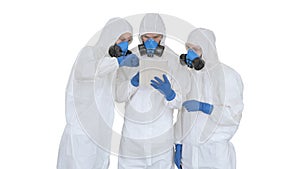 Doctors or scientists wearing hazmat suits working together on digital tablet on white background.
