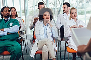 Doctors on seminar in lecture hall at hospital. Hospital, profession, people and medicine concept