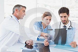 Doctors sitting together with x-rays