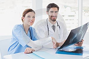 Doctors sitting together with x-rays