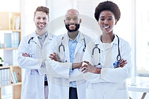 Doctors, team and arms crossed with health, diversity and cardiology, surgeon group collaboration in portrait. Confident