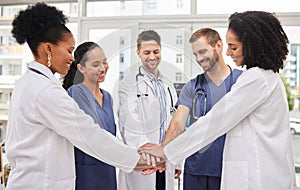 Doctors, teamwork and hands together in meeting, motivation or unity in healthcare together at hospital. Happy group of