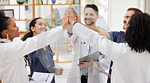 Doctors, teamwork and high five in meeting, motivation or success in healthcare together at hospital. Happy group of