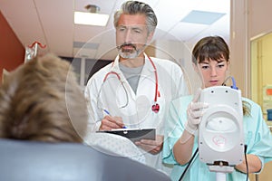 Doctors telling patient diagnosis