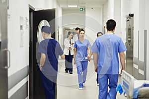 Doctors walking through corridor in hospital