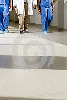 Doctors walking down corridor