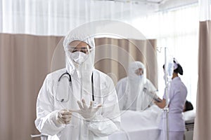 Doctors are wearing COVID-19 protective gloves, examining and treating patients in state quarantine control areas