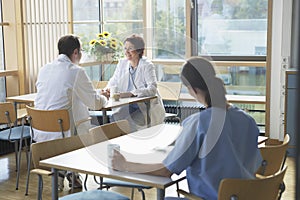 Doctors On Work Break In Cafeteria