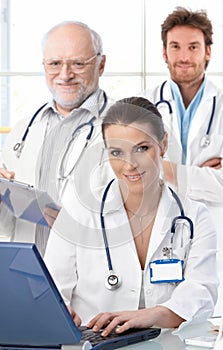 Doctors working at desk photo