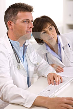 Doctors working at office