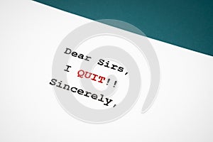 The Document from employee to employer with note text DEAR Sirs, I quit sincerely, concept of decision making to resign or to quit