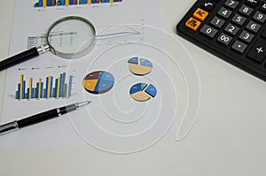 Document finance report paper datum graph diagram investment and pen magnifying glass.Business accounting economy information