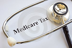 Document about Medicare tax and stethoscope.