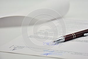 Document signed with a pen, contract photo