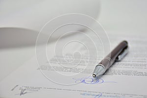 Document signed with a pen, contract photo