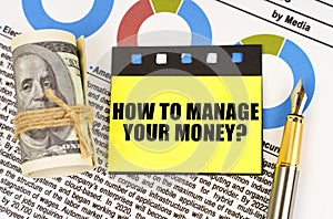 On documents with diagrams, dollars and stickers with the inscription - How to manage your money