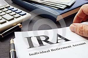 Documents about Individual retirement account IRA on a desk.