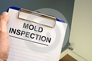 Documents about mold inspection with clipboard photo