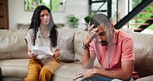 Documents, stress for tax and couple with financial crisis on sofa in living room of home for problem solving. Debt