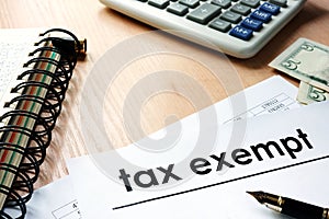 Documents with title tax exempt on a table photo