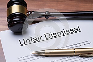 Documents Of Unfair Dismissal With Gavel And Pen