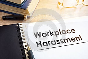 Documents about workplace harassment. photo