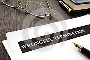 Documents about Wrongful termination on a desk