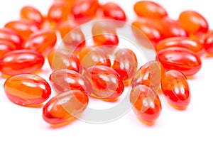 Docusate sodium dioctyl sodium sulfosuccinate red soft gel capsules isolated on white photo