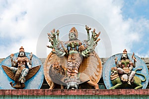 Goddess statue on big Hindu temple wall photo