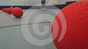 Close up of dodgeballs lined up photo