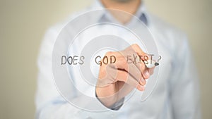 Does God Exist, Man writing on transparent screen photo