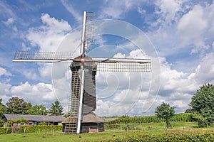 Doesburger mill in a Dutch landscape in Ede, Netherlands.