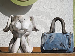 Dog and blue female bag sculpture detail