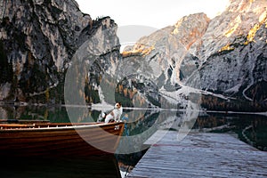 Dog in a boat on a lake. Jack Russell Terrier in nature. Traveling with a pet to Italy, Lago di Braies