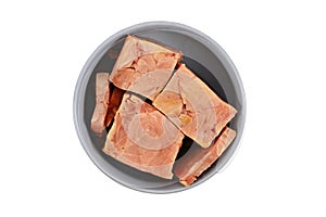 Dog bowl with big chunks of salmon fish for dog or cat raw biologically appropriate feeding