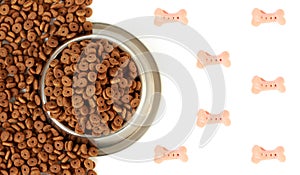 Dog bowl with pet feed on the half white background and scattered dry food