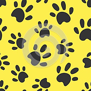 Dog or cat paws traces illustration. Grey stamps on yellow background. Seamless pattern. For logo, wallpaper, fabric, packing,