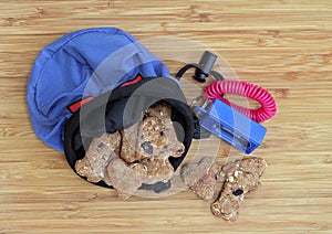 Dog cookies with a training pouch and clicker.  Top view