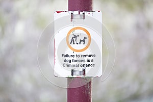 Dog faeces failure to remove is a criminal offence sign