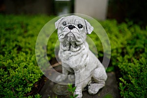 Dog figure bravely guarding a grave