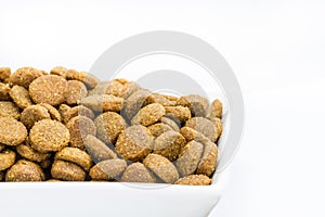 Dog food in a bowl on white background