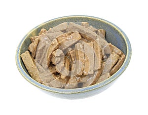 Dog food in a stoneware bowl photo