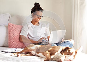 Dog, happy woman and laptop with tired animal in a bedroom with remote work, pet and rescue in a bed. Home, freelancer