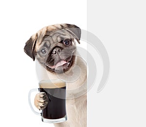 Dog holding beer peeking from behind empty board. isolated on white