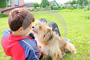 Dog licking the boys face
